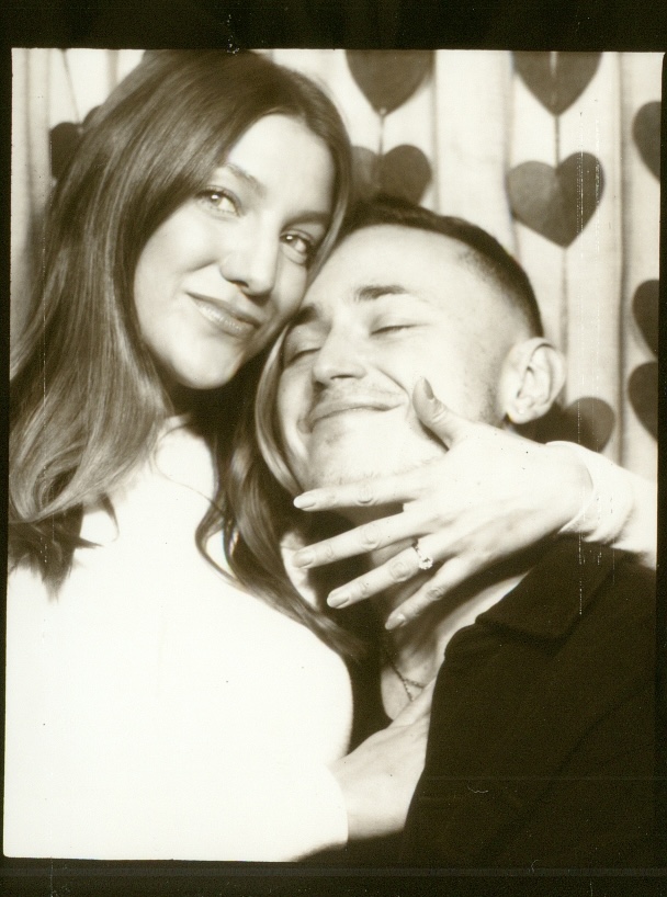 Barron and Nina in a black and white photo booth portrait